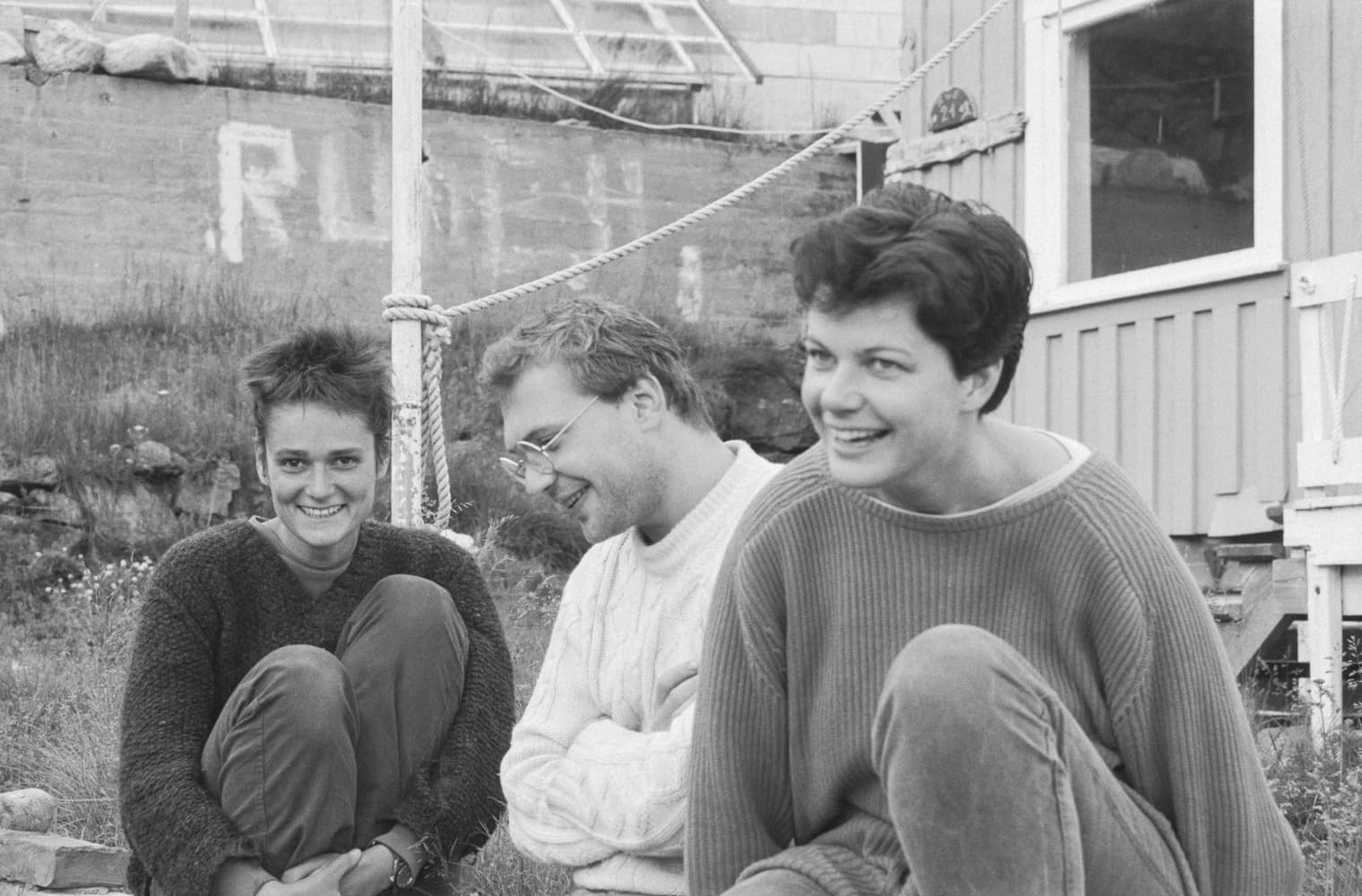 People − Three students in front of building 21.